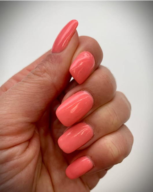 Manicure showing Coral Me, Maybe Dip Powder
